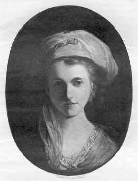 A black and white oval portrait of a woman with light hair styled back and partially covered by a loose, draped headscarf. She has a calm expression, looking directly forward with soft facial features. She wears a garment with a visible neckline adorned with a decorative border. The background is plain and darker, highlighting the subject's face.