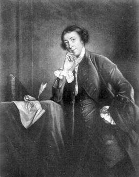 A black and white portrait of a man dressed in 18th-century attire, standing beside a table with a cloth, a quill, and an open book. The man poses with one hand resting on his hip and the other hand touching his chin, looking slightly to his left. The background is plain and dark, highlighting the subject.